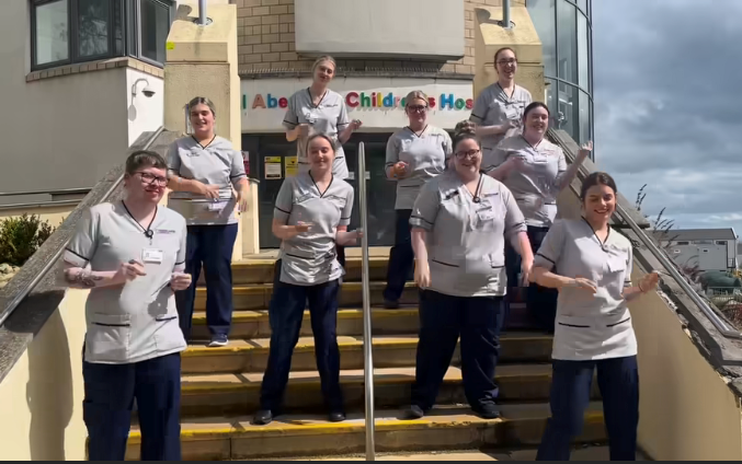 Nurses outside on the steps at RACH